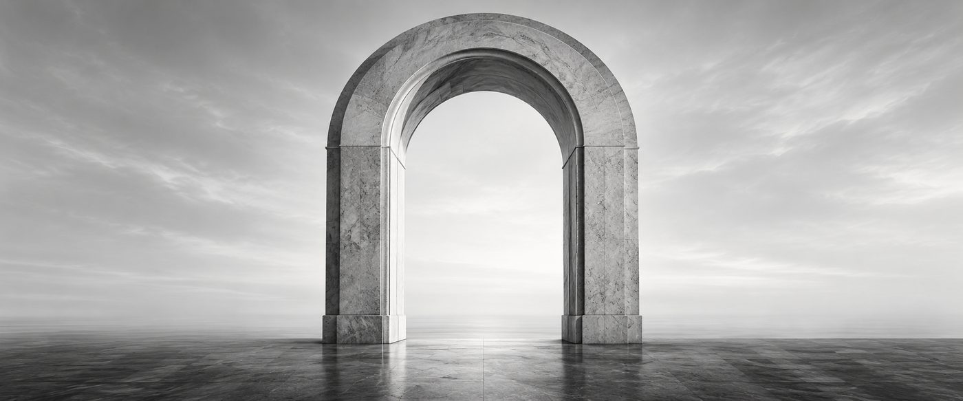 A marble arch standing in an open space.